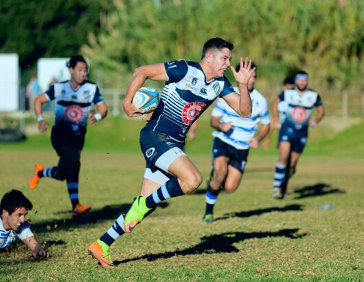 The image of a rugby player on the field